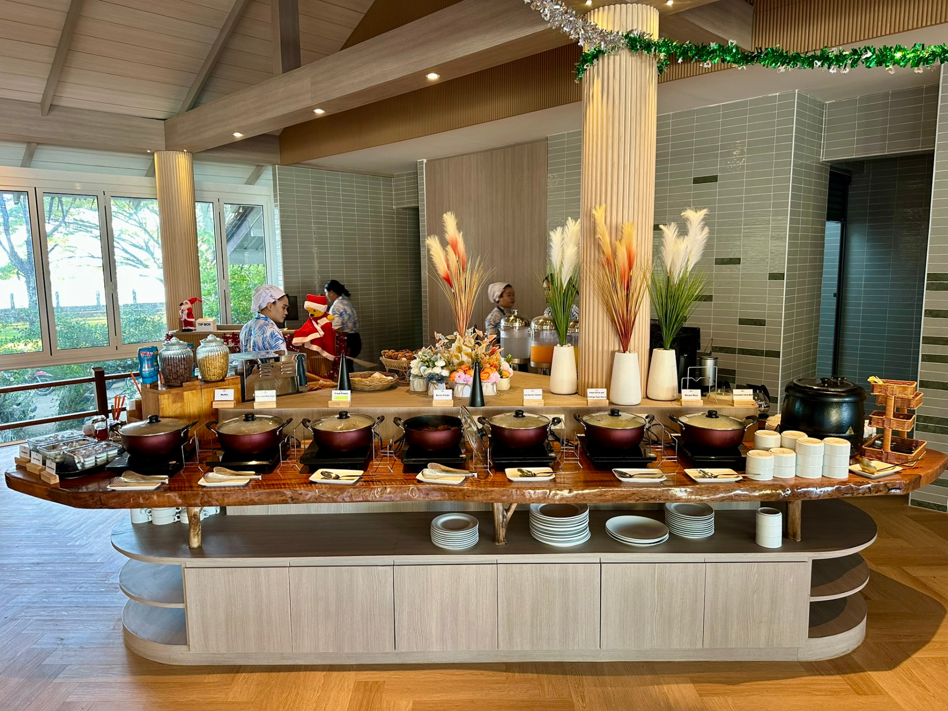 The breakfast buffet counter at Breezy Bites with the kitchen team serving