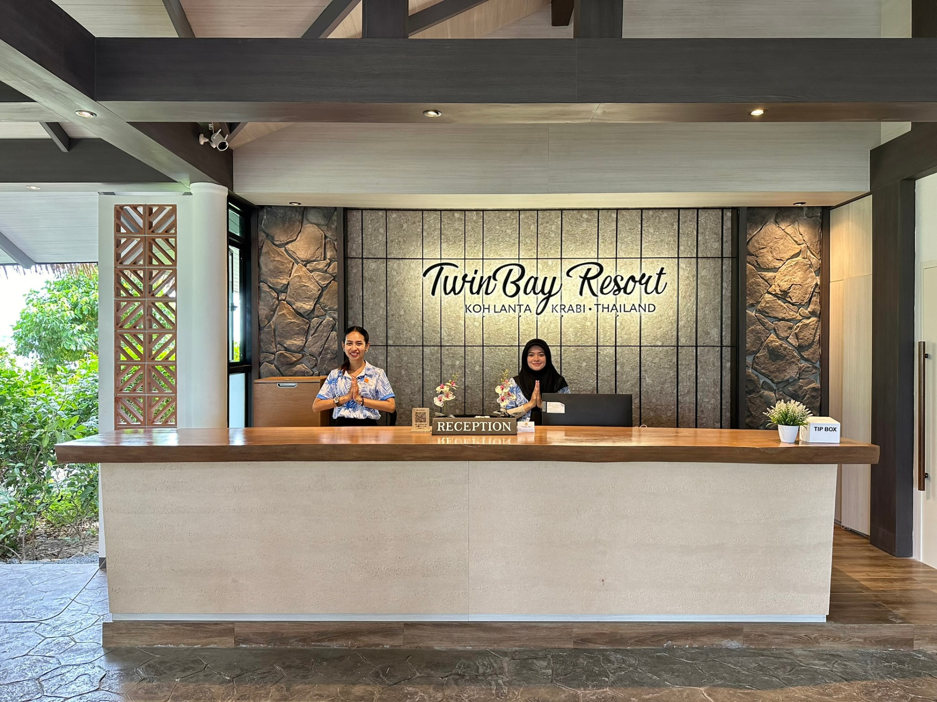 A TwinBay team member welcoming guests