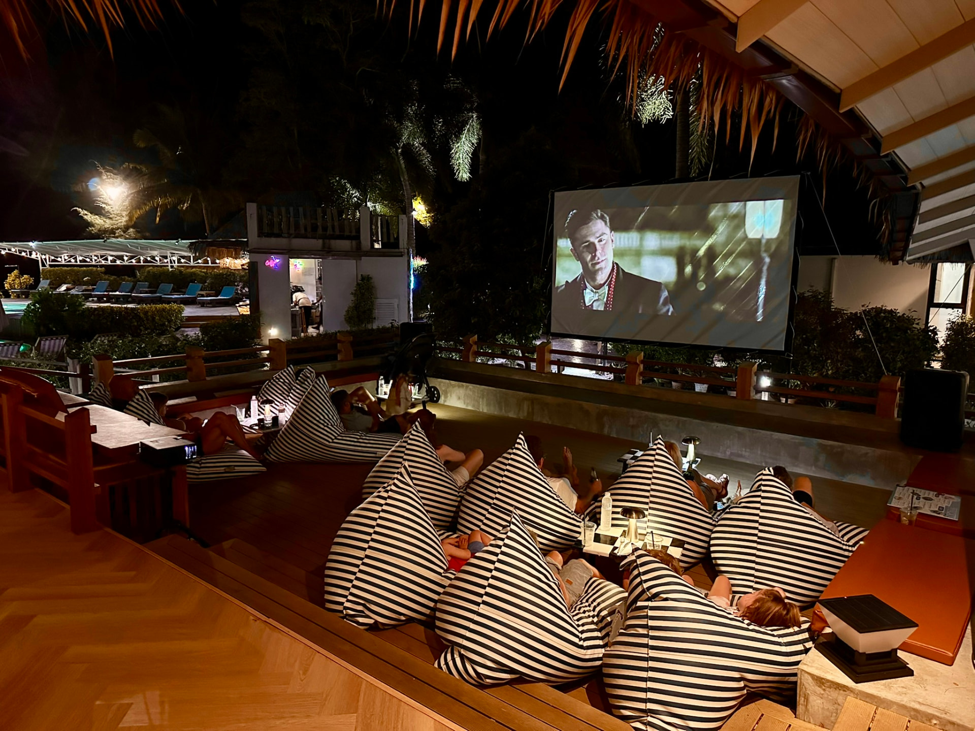 Guests stretched out on bean bags watching the late film at Breezy Bites