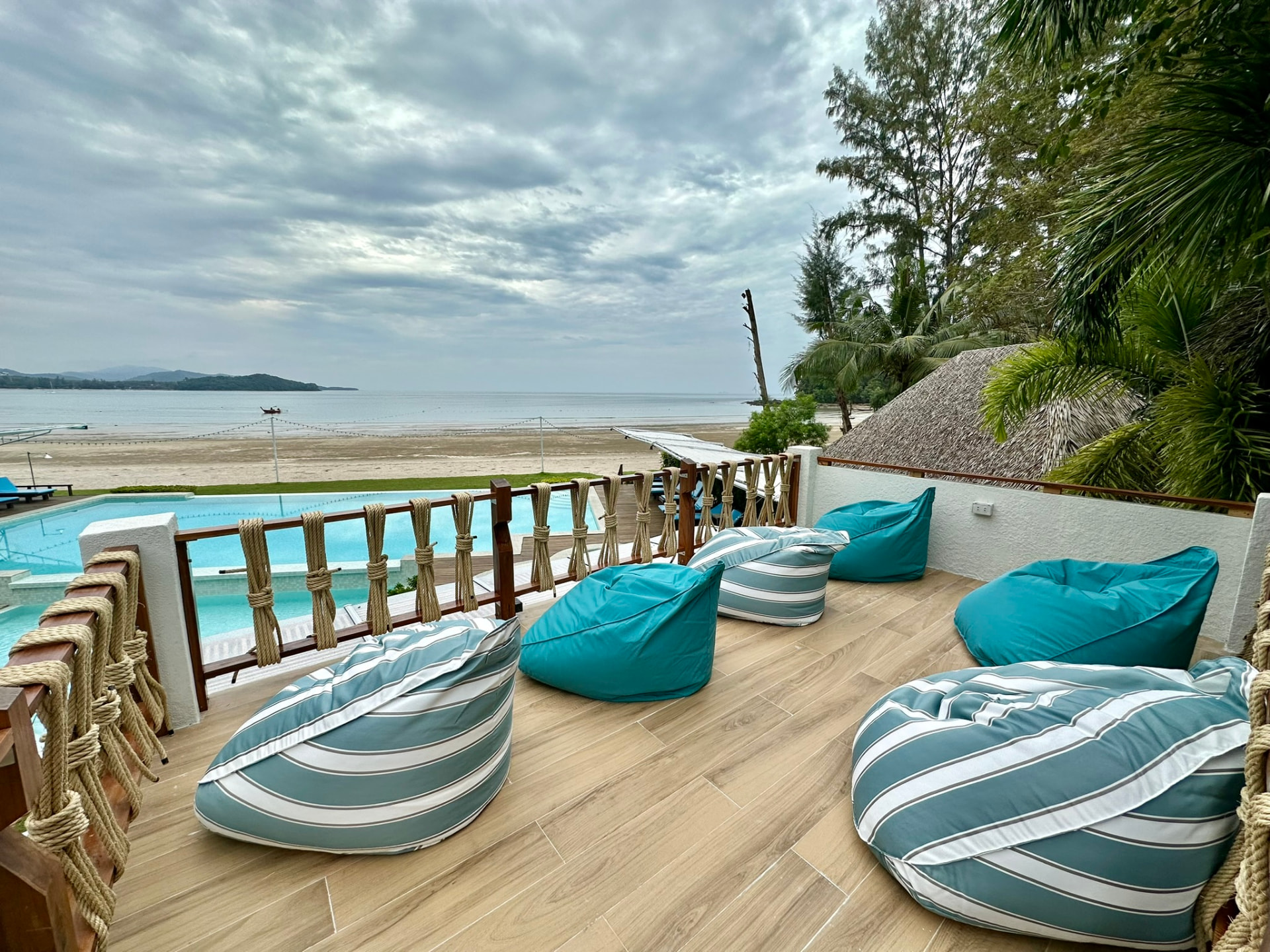 Bean bags on the Northstar terrace looking over the pool to the beach