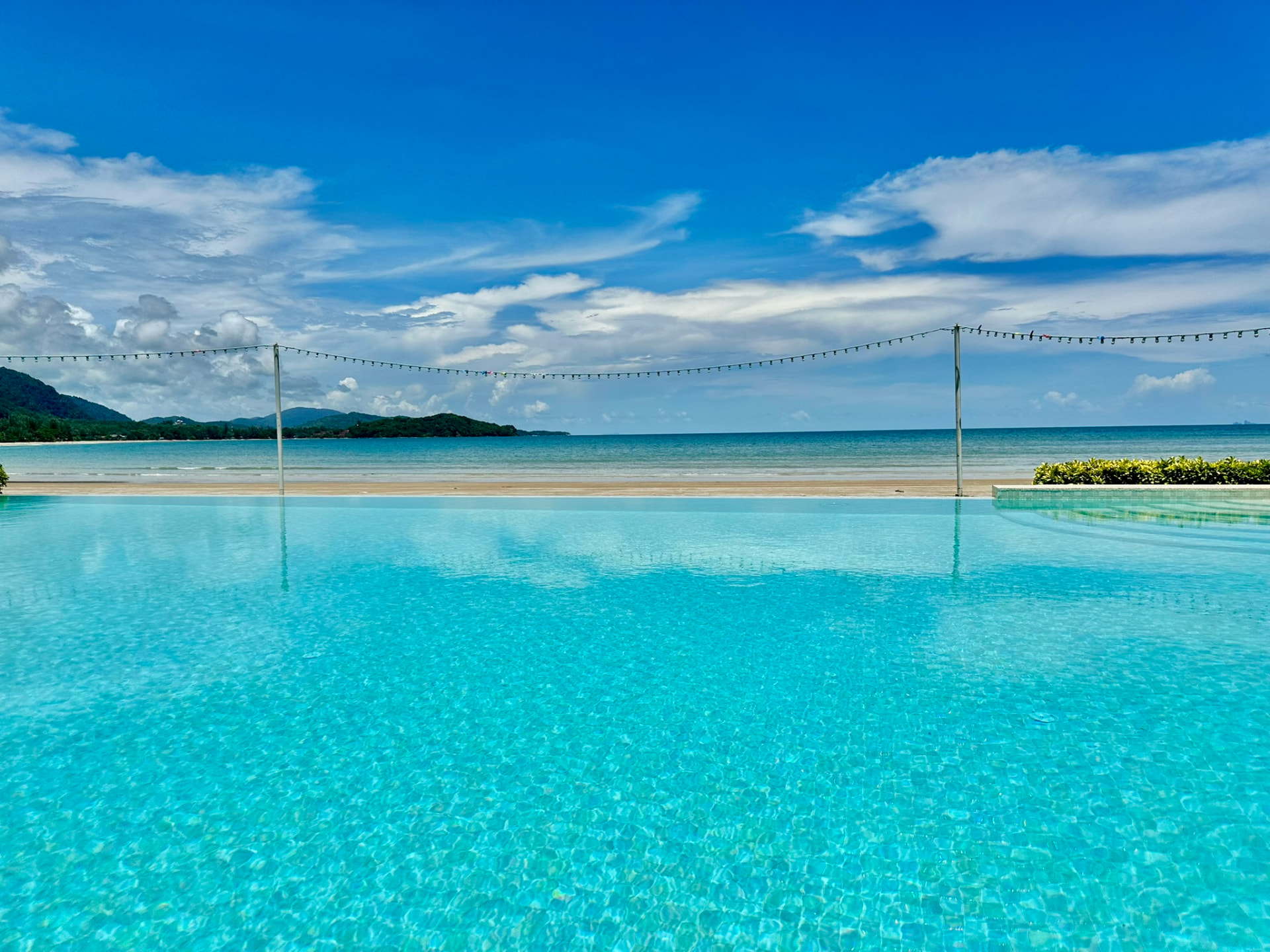 The infinity pool looking out to the beach and the Andaman Sea at TwinBay Resort