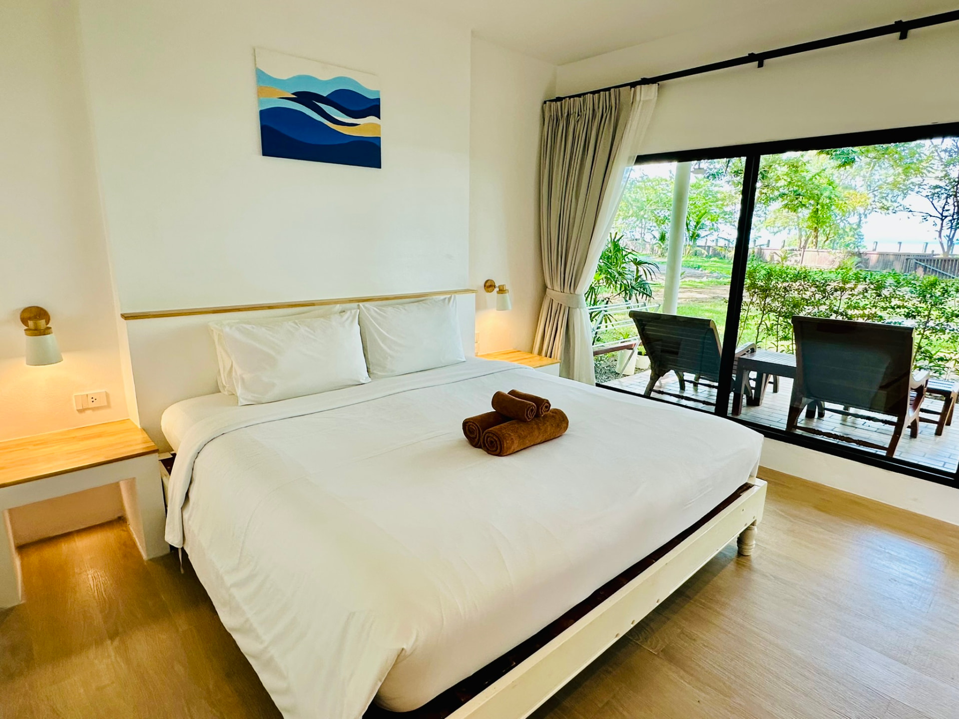 Interior of a Standard Garden Bungalow with a king bed and garden view at TwinBay Resort