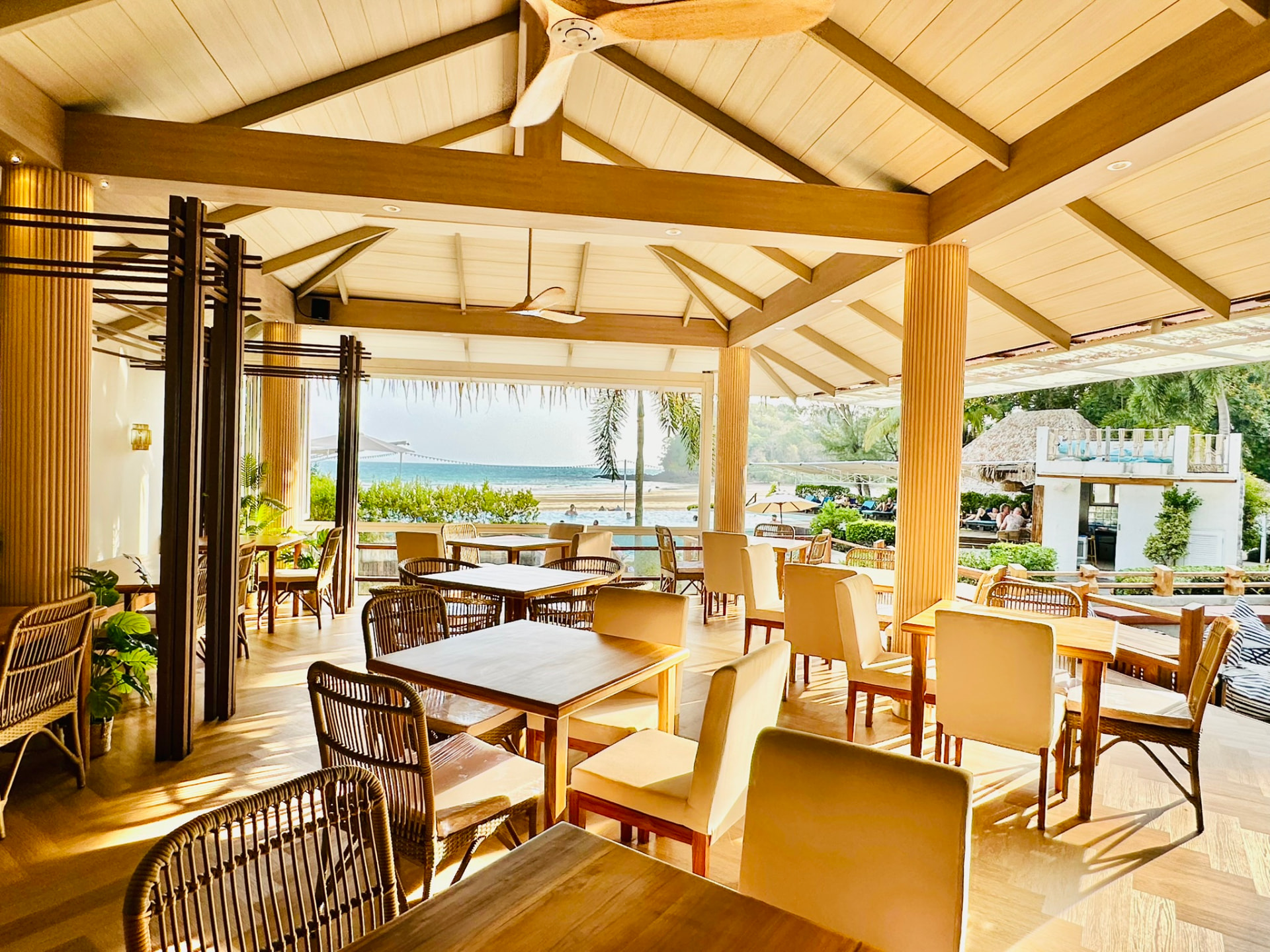 Breezy Bites restaurant at TwinBay Resort with open sides looking out to the sea