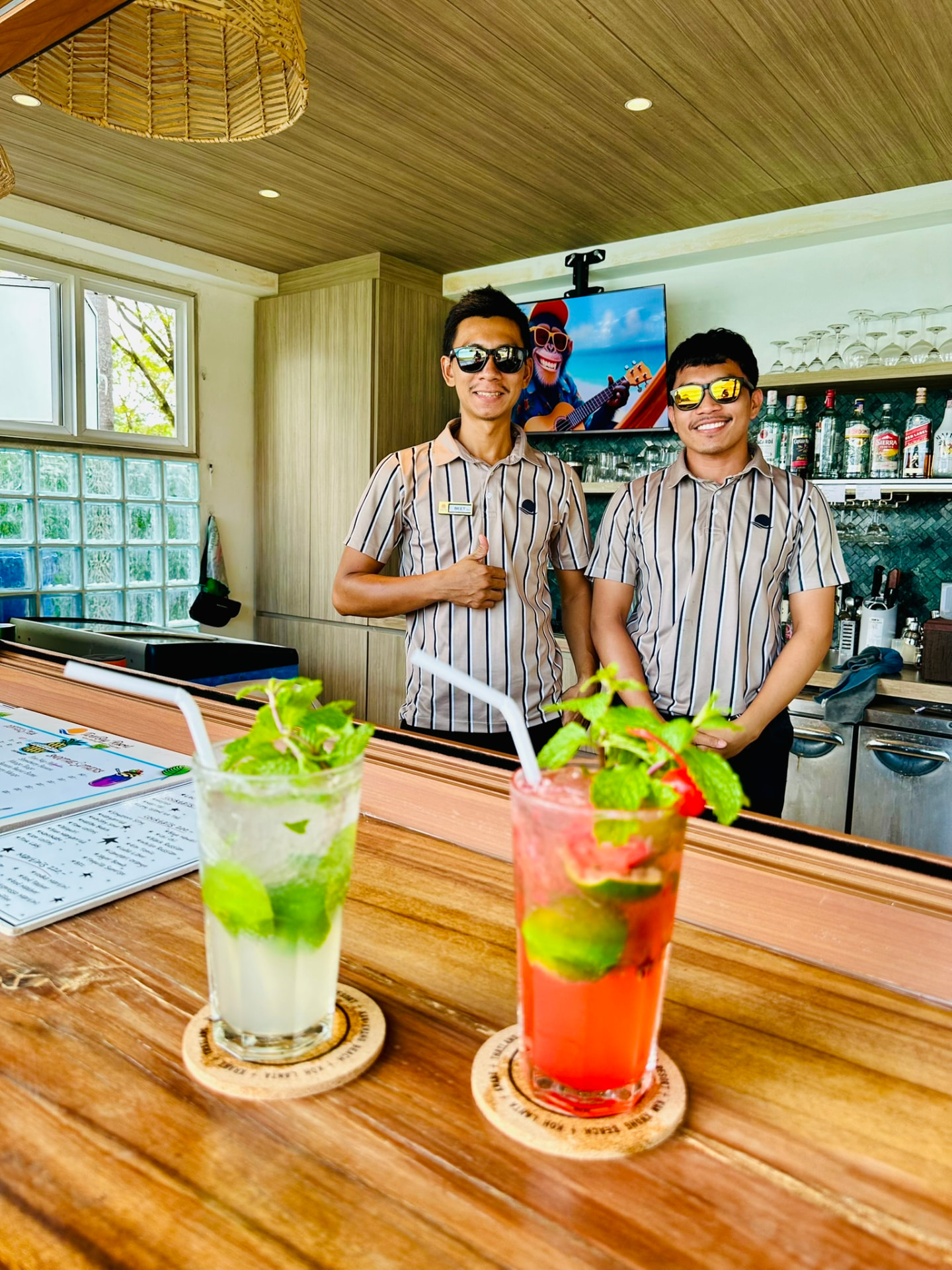 The Northstar Bar team at TwinBay Resort with two fresh mojitos on the counter