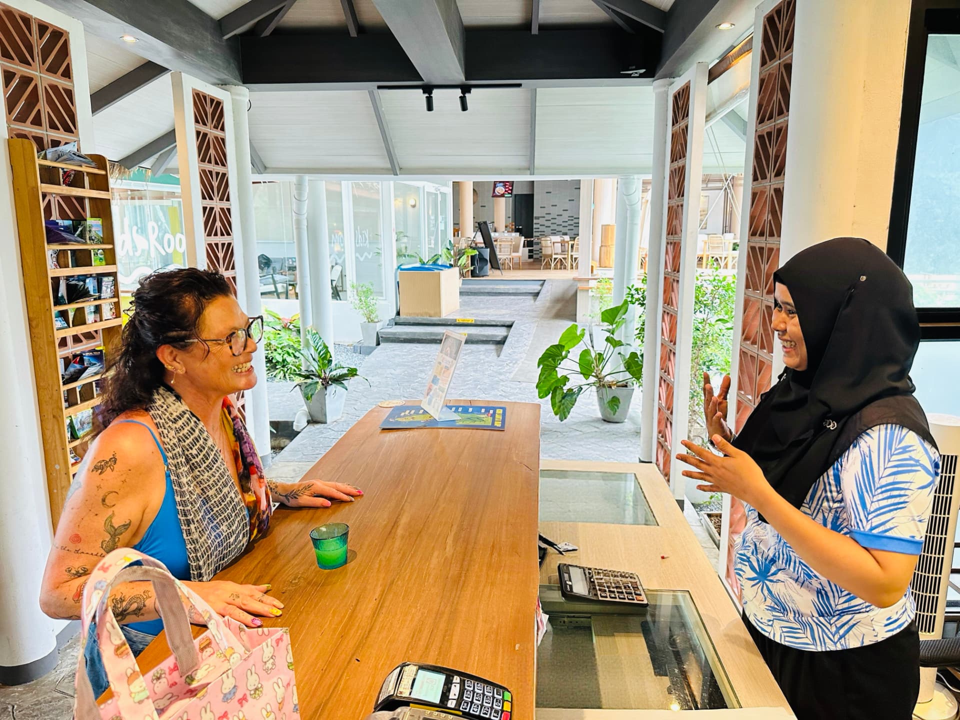 A TwinBay team member welcoming a guest at reception
