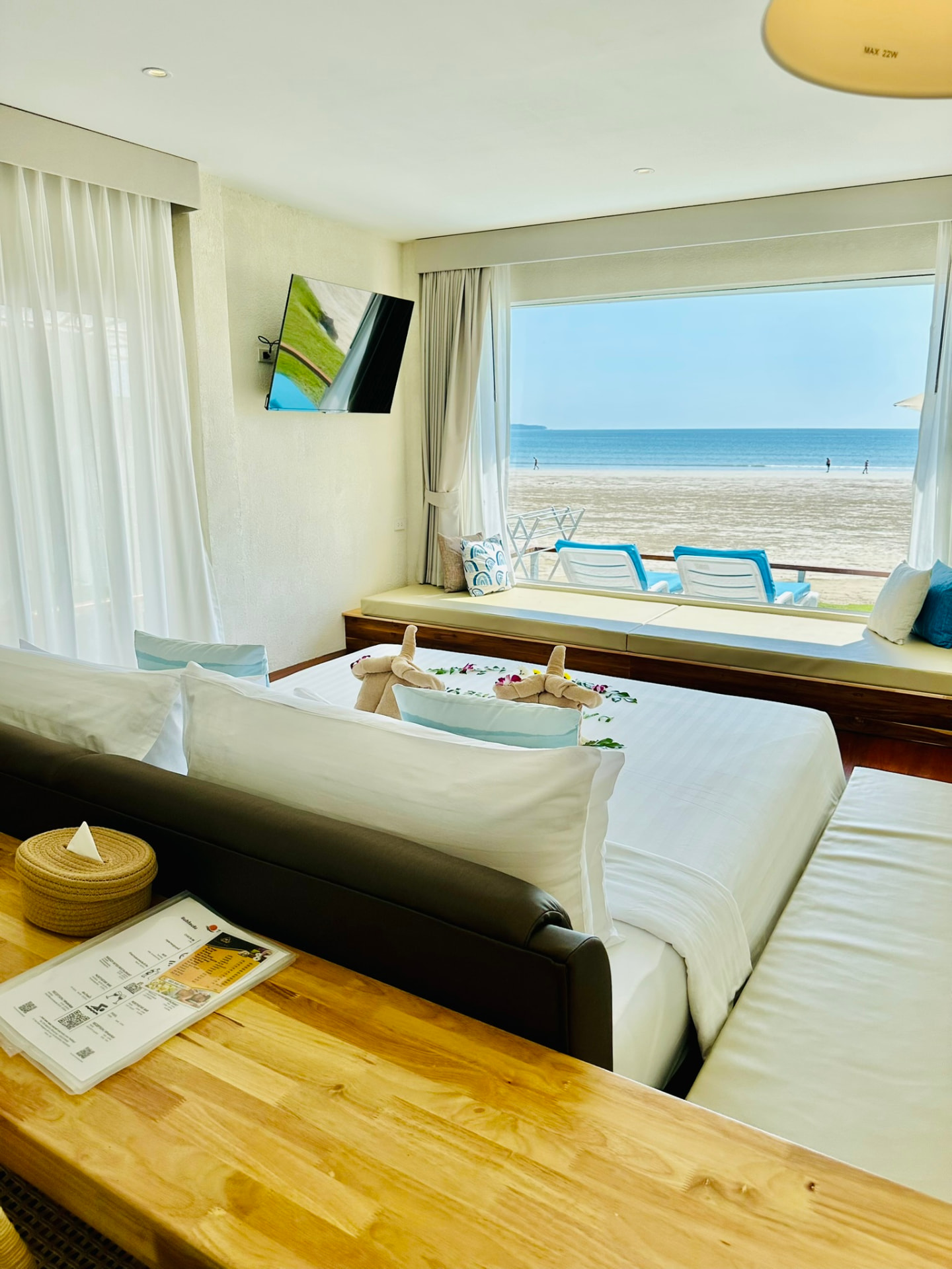 Window day bed and king bed looking out over the sand to the Andaman Sea