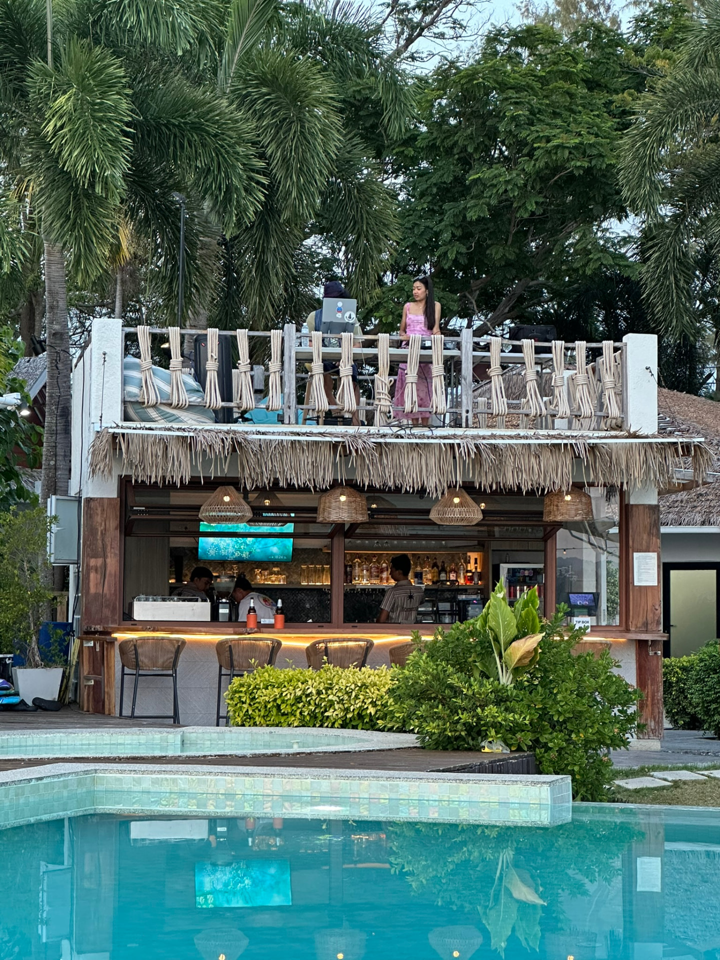 A DJ playing on the upper deck above Northstar Bar at dusk