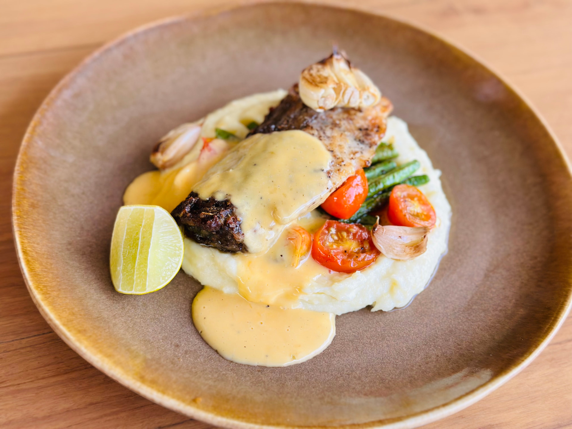 Grilled fish with mashed potatoes, green beans and roasted tomatoes at Breezy Bites