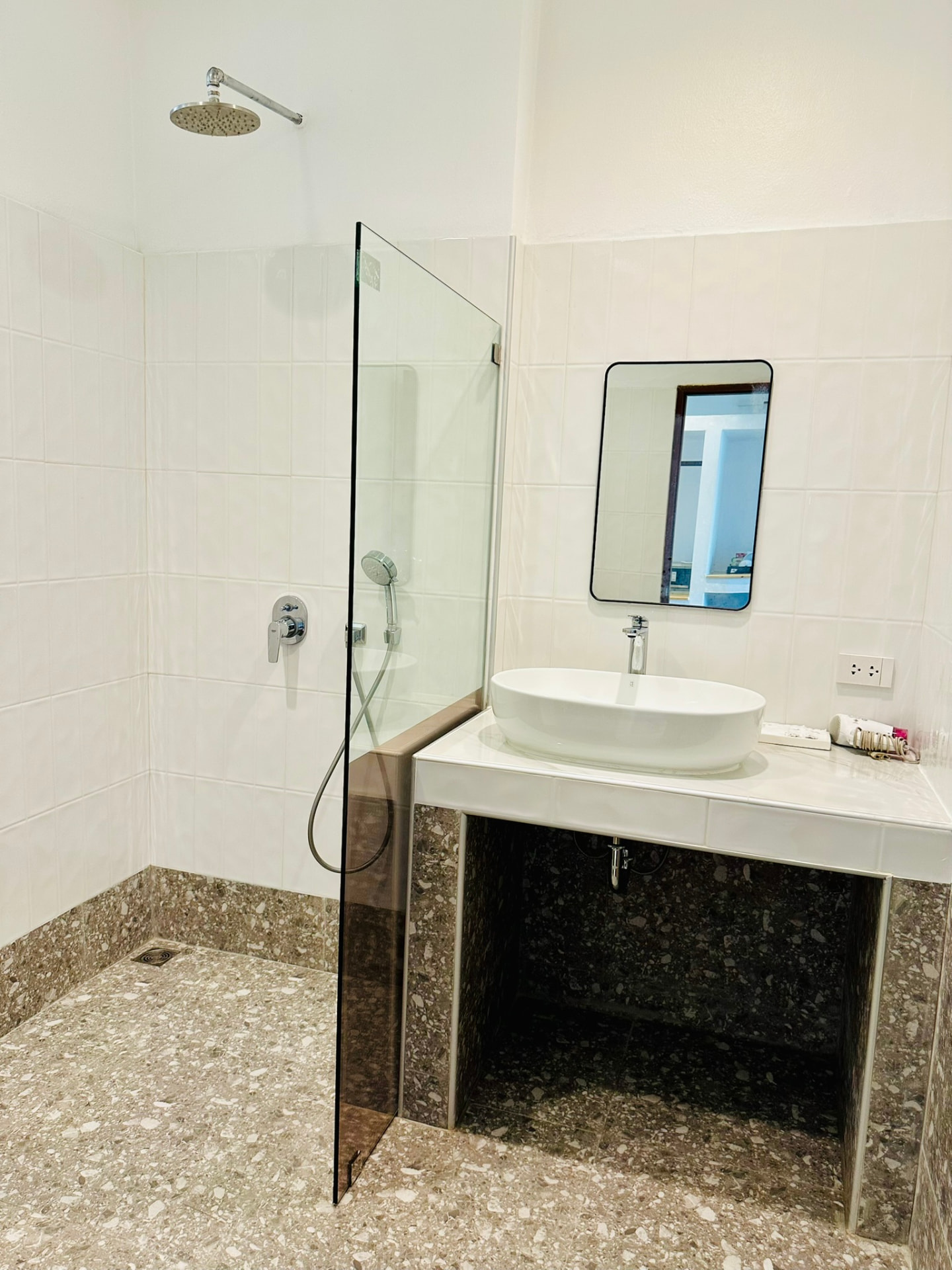 Bathroom with walk-in rain shower, terrazzo floor and vessel basin